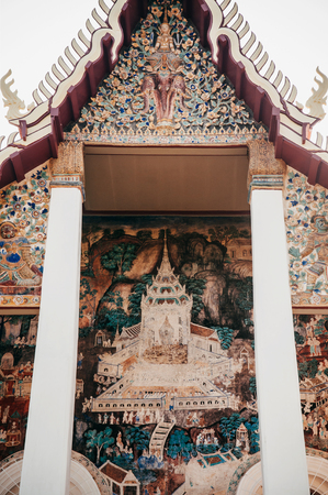 MAR 1, 2018 Uthaithani - Thailand : Ancient historic Buddhism mural painting at Wat Uposatharam Temple or Wat Bot at noon under clear blue sky, Historical landmark of Uthaithani provinceのeditorial素材
