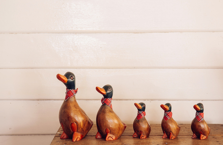 Handmade craft vintage carved wood duck model for home decoration on retro wooden boxの写真素材