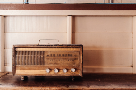 Old Retro vinatge radio antique radio on white wooden background, home decoration itemの写真素材