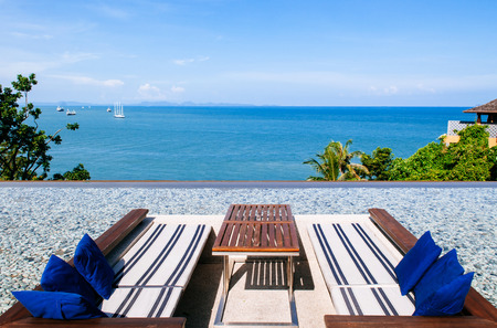 Vacation Relaxation sunken lounge seat in infinity edge pool with ocean andaman sea view, Phuket...