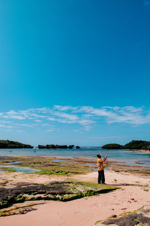 JAN 31, 2013 Okinawa, Japan : Rock and stone scenery of Hoshizuna beach, Iriomote isalnd - Tropical island with rocky beach and capeのeditorial素材