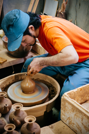 JAN 28, 2013 Naha, Okinawa, JAPAN : Man making Okinawa style pottery art, clay work close upのeditorial素材