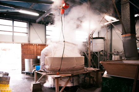 Dec 12, 2012 Narita, Chiba, JAPAN - Rice steaming old fashion process of making Sake liqour in local vinatge brewery houseのeditorial素材