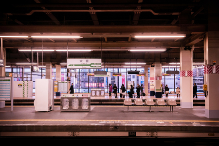 DEC 10, 2012 Saitama, JAPAN - Omiya station platform with waiting seats and station sign, neon light