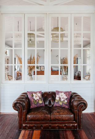 JUN 13, 2013 Thailand : English country vintage living room interior with natural light through window, pillow, wall ornamentsのeditorial素材