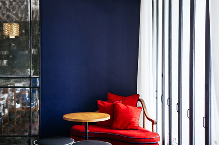JUN 6, 2013 Chiang Mai, THAILAND - Living room with modern colorful couch, wooden table and lamp, natural lightのeditorial素材