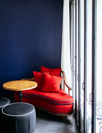 JUN 6, 2013 Chiang Mai, THAILAND - Living room with modern colorful couch, wooden table and lamp, natural lightのeditorial素材