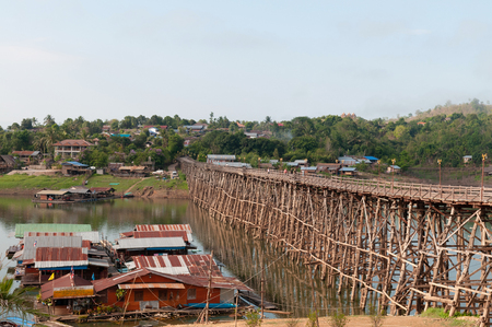 landscape of floating village raft houses and Mon wooden bridge in Sangkhlaburi, Kanchanaburi, Thailandの写真素材