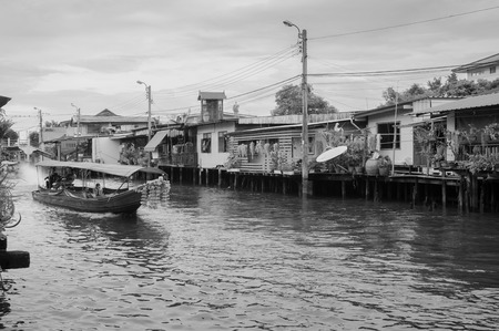 JUL 10, 2018 Bangkok, Thailand - Thai long tail boat with garlands in Banhkok's canal (Klong), famous river and canal transportationのeditorial素材