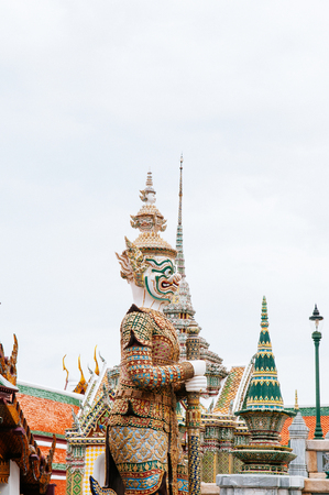Beautiful elegant Artisan ceramic facade and giant statue of Bangkok Grand Palace building - Wat Phra Kaew - Emerald Buddha templeのeditorial素材