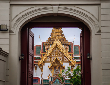 Bangkok Grand Palace golden facade of "Dusit Maha Prasat" throne hall seen through main gateのeditorial素材