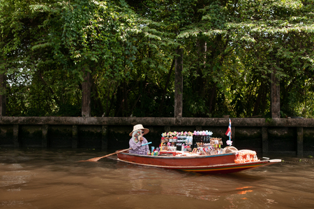 APR 20, 2013 Bangkok, Thailand - Thai traditional grocery rowing boat with garlands in Bangkok canal (Klong), local Thai cultureのeditorial素材