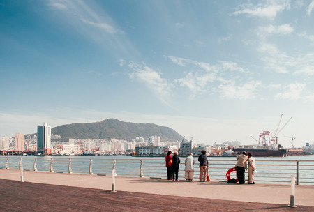 OCT 25, 2013 Busan, South Korea - Busan harbour view at Jagalchi seafood market with a tourist group, famous tourist attractionのeditorial素材