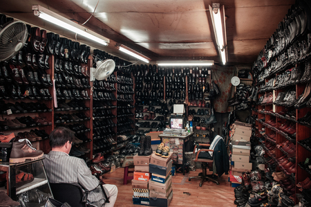 OCT 25, 2013 Busan, South Korea - Old classic vintage leather shoe shop in Busan Jagalchi marketのeditorial素材