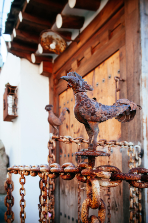 Bukchon Hanok Village, old traditional Korean house architecture called - Hanok - with antique iron rooster model decoration. Famous tourist area near Gyeongbok palaceのeditorial素材