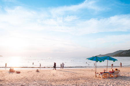 FEB 10, 2013 Phuket, THAILAND - Phuket famous Patong beach with colourful umbrellas, summer tropical island white sand in warm evening lightのeditorial素材