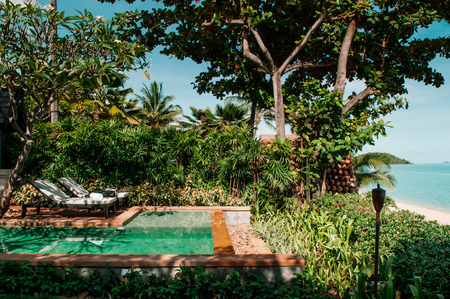 Nov 13, 2013 Samui, Thailand - Tropical Resort infinity edge pool on Samui island in summer, tree shadow on water surfaceのeditorial素材