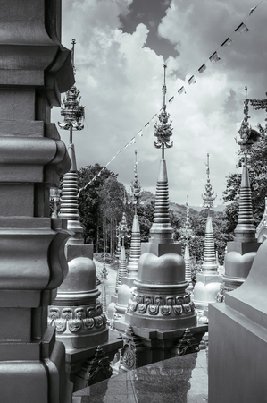 Black and white image of Thai many golden pagodas of Wat Pasawangboon in KhaengKhoi, Saraburi, Thailandの写真素材