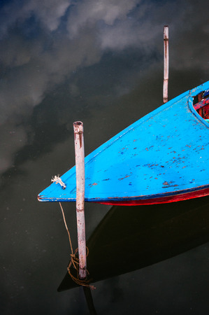 Traditional Thailand wooden fishing boat in tropical canal of Ban Nam Chiao - Trat province.の写真素材