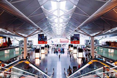 MAY 30, 2013 Nagoya, Japan - Modern Interior and truss ceiling structure with natural light from roof of Nagoya Chubu Centrair Airport . People and passengers at international airportのeditorial素材