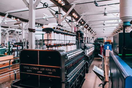 MAY 30, 2013 Nagoya, Japan - Vintage Power loom machine exhibits at Commemorative Museum of Industry and Technology or Toyota museum. Showing production technology from fabric factory until became biggest Car companyのeditorial素材