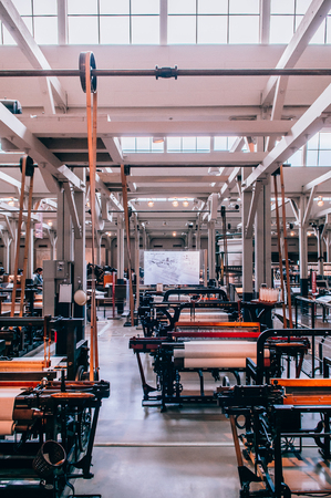 MAY 30, 2013 Nagoya, Japan - Vintage Power loom machine exhibits at Commemorative Museum of Industry and Technology or Toyota museum. Showing production technology from fabric factory until became biggest Car companyのeditorial素材