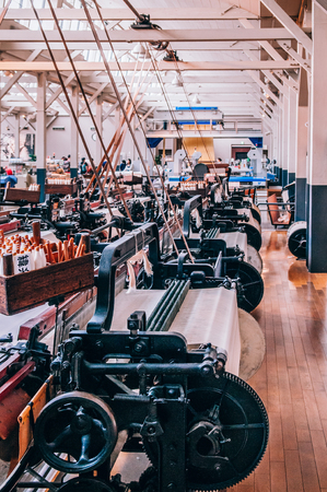 MAY 30, 2013 Nagoya, Japan - Vintage Power loom machine exhibits at Commemorative Museum of Industry and Technology or Toyota museum. Showing production technology from fabric factory until became biggest Car companyのeditorial素材