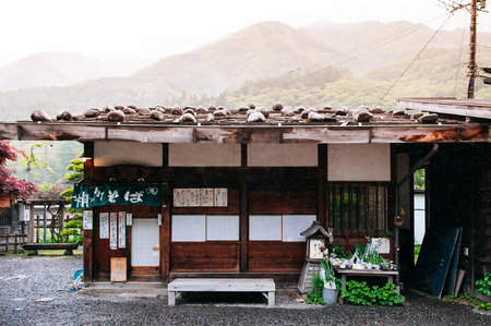 MAY 29, 2013 Nagano, Japan - Old wooden house of Narai Post town (Narai-Juku) becames Sabo noodle shop. The midpoint town on Nakasendo road, Edo trading route between old Tokyo and Kyotoのeditorial素材