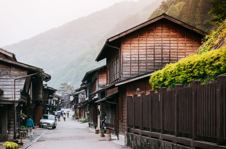 MAY 29, 2013 Nagano, Japan - Old wooden house and narrow street of Narai Post town (Narai-Juku) the midpoint town on Nakasendo road, Edo period trading route between old Tokyo and Kyotoのeditorial素材