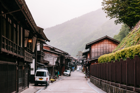 MAY 29, 2013 Nagano, Japan - Old wooden house and narrow street of Narai Post town (Narai-Juku) the midpoint town on Nakasendo road, Edo period trading route between old Tokyo and Kyotoのeditorial素材