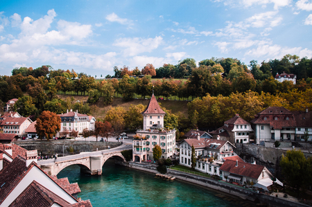 Felsenburg castle tower and Untertorbrucke (Utertor) bridge over turquoise Aare river, Old town Bern - Switzerlandのeditorial素材