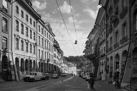 SEP 27, 2103 Bern, Switzerland - People walking among vintage historic Swiss style residential buildings with bright sunlight in old town district of Bernのeditorial素材