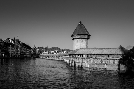SEP 24, 2103 Lucerne, Switzerland - Black and white image of medieval Lucerne Chapel Bridge in bright clear sky evening, Switzerlandのeditorial素材