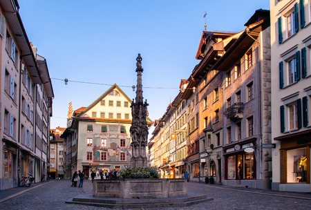 SEP 24, 2013 Luzern, Switzerland - Old vintage buildings, beautiful fountain at Wein-markt platz square in Lucerne medieval old town areaのeditorial素材