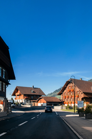 SEP 23, 2013 Entlebuch, Switzerland - Local guesthouse chalets along the street in Hasle town in...