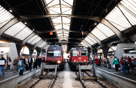 SEP 23,2013 Zurich, Switzerland - Swiss train at Zurich HB station platform with passengers, Train travel concept imageのeditorial素材