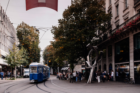 SEP 28, 2013 Zurich, Switzerland - Street tram public transport and tourists in city center, many people at shopping street in Zurich city centerのeditorial素材