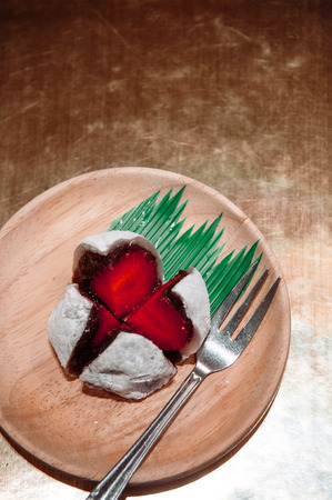 Ichigo Daifuku, strawberry mochi Japanese confection made from a strawberry, rice cake and red bean. Top view shotの写真素材