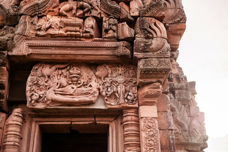 Carved sandstone facade famous Narai Bantomsin lintel at its place of ancient Phanom Rung castle, Khmer architecture inspire from Hindu religionの写真素材