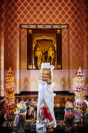 MAY 31, 2014 Buriram, Thailand - Interior and sacred pillar with Thai north-eastern style flower arrangemment at Buriram city pillar shrineのeditorial素材