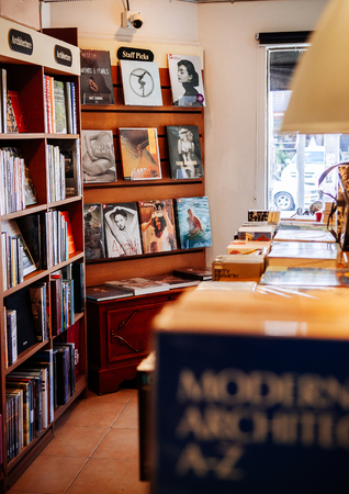 FEB 12, Chiang Mai, THAILAND -Various book collections on wooden shelf with out focus foreground in small bookstoreのeditorial素材