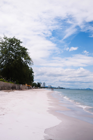 Hua Hin beach peaceful sea in summer, Thailand coast  tropical beach destination with tourist walking.の写真素材