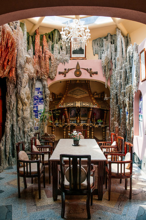 FEB 26, 2014 Dalat, Vietnam - Fantasy Dinner room interior with dinner table of crazy house Hang Nga guesthouse. Most famous tourist attraction in cityのeditorial素材