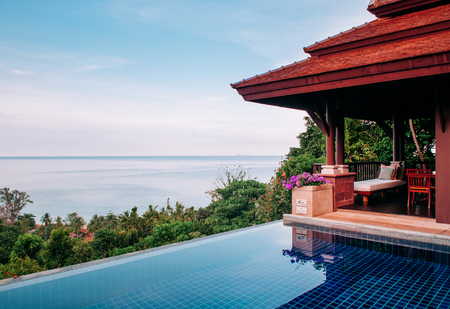 MAY 18, 2014 Krabi, THAILAND - Hill top luxury villa infinity edge pool with seascape, Koh Lanta tropical resort outdoor space in summerのeditorial素材