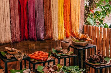 Details of natural colourful silk thread fiber and natural colour dye process  raw materials. Traditional sericulture Thai silk making in Countrysideの写真素材