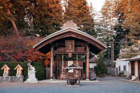 DEC 2, 2018 Iwate, Japan - Morioka Hachimangu Shrine old wooden Chouzuya sacred water pavillion at sunset with warm tone evening light - Tohoku region beautiful landmarkのeditorial素材