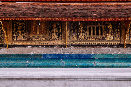 Golden Buddism Mural art and mosaic wall at Main hall of Wat Xieng thong, Luang Prabang, Laosのeditorial素材