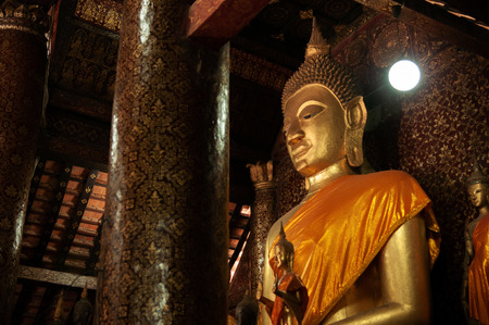 APR 5 Luang Prabang, Laos -Beautiful old golden Buddha statue hall with mural art painting at Wat Xieng thong,のeditorial素材