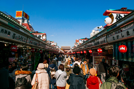 NOV 29, 2018 Tokyo, Japan - Asakusa Sensoji temple giant sacred red lantern or Chochin at Hozomon gate with many tourists. Tokyo most famous attraction and recognized symbolのeditorial素材