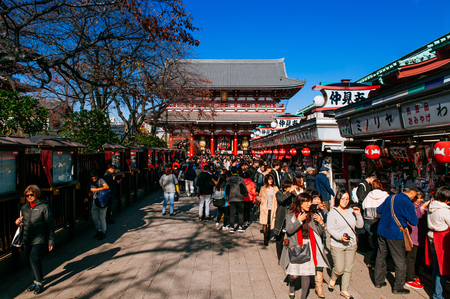 NOV 29, 2018 Tokyo, Japan - Asakusa Sensoji temple giant sacred red lantern or Chochin at Hozomon gate with many tourists. Tokyo most famous attraction and recognized symbolのeditorial素材